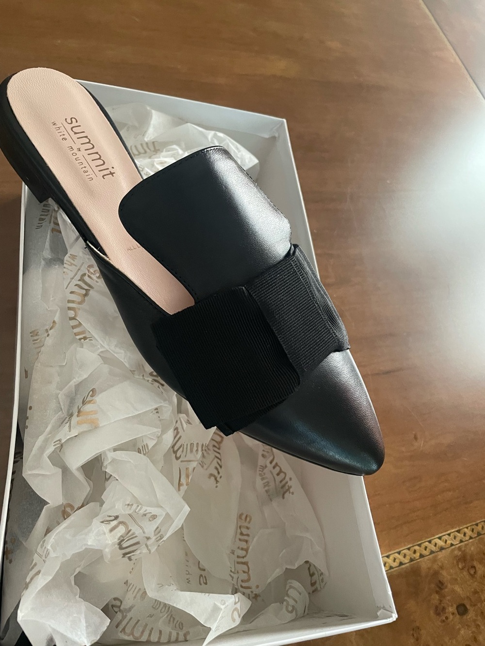 Black leather Pointed Slip-On Mule with Bow Accent.Made in Italy.